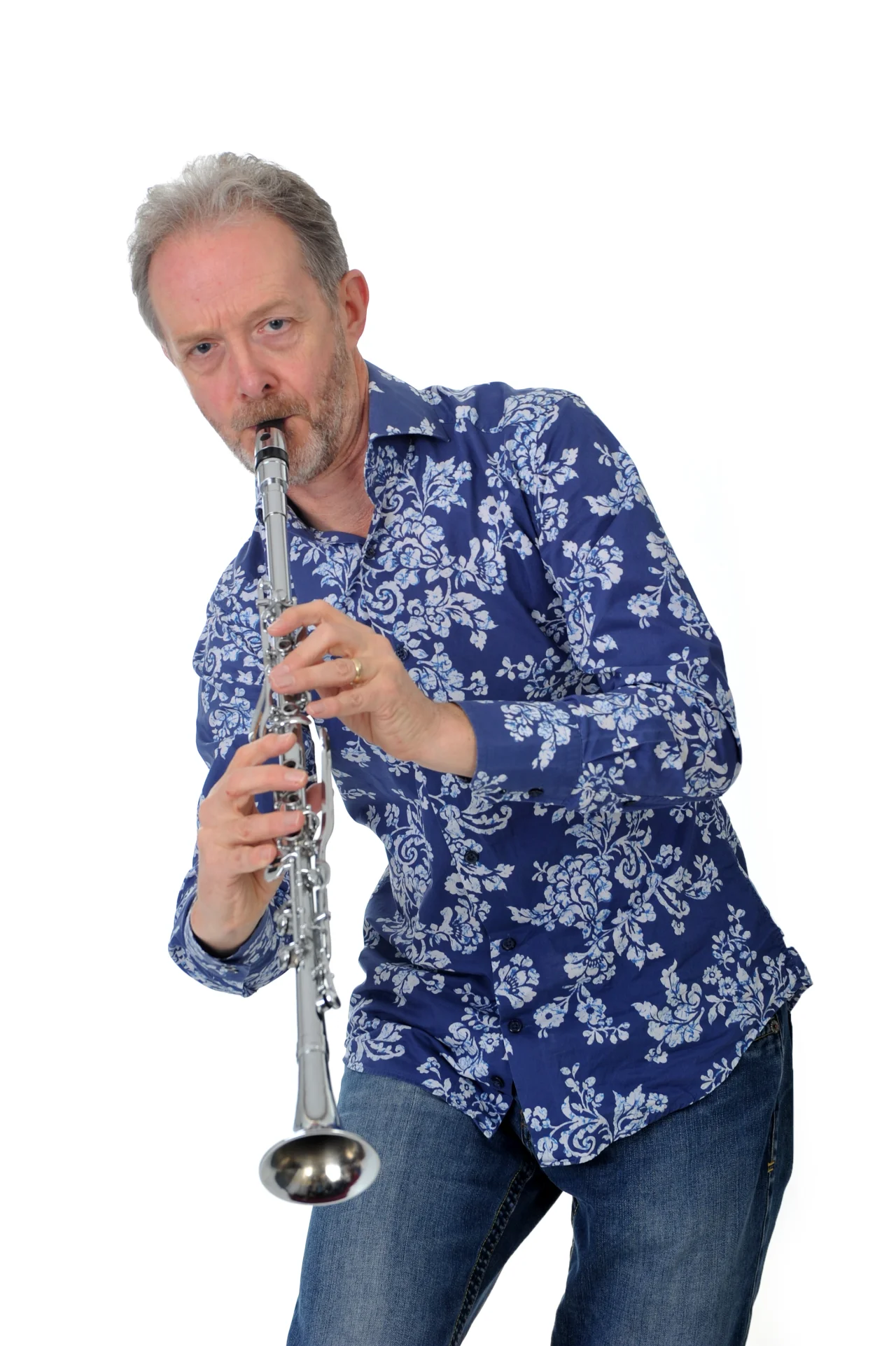 Andy Watts plays clarinet. The background is white.